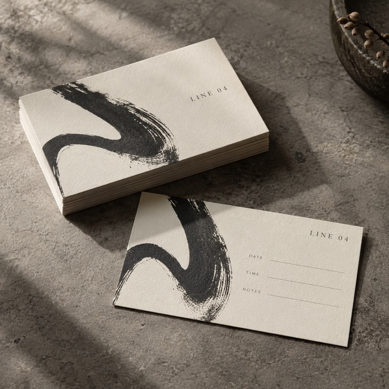 Appointment Cards — a charcoal abstract brush gesture on warm ivory