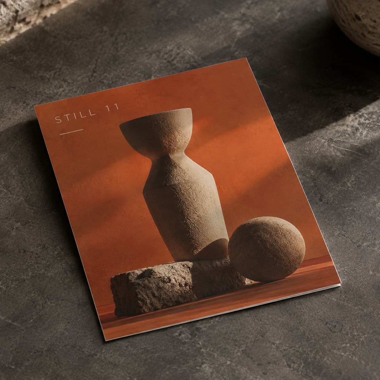 Essential Flyers — burnt orange sculptural still life composition