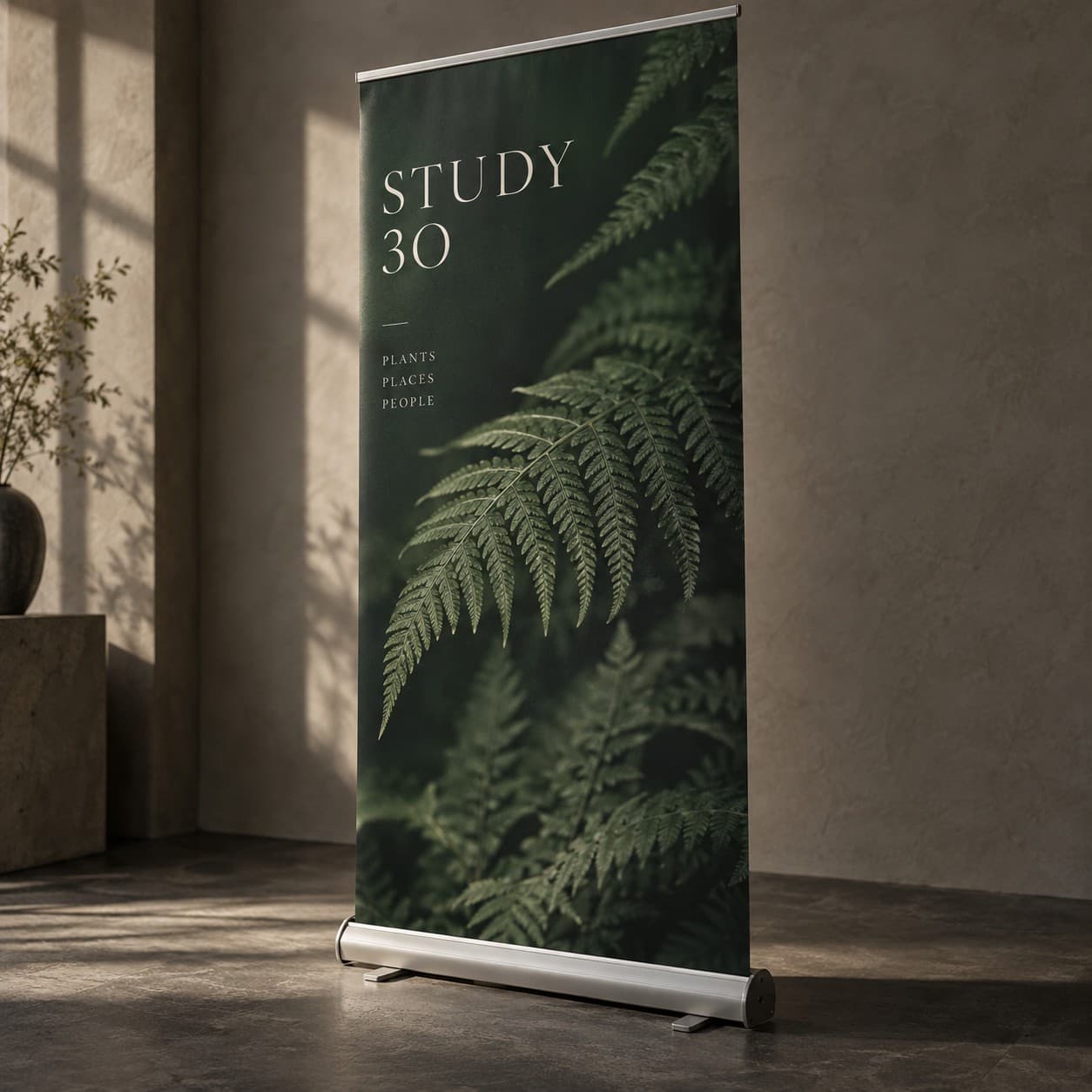 Roller Banner — dark green fern and fine serif typography
