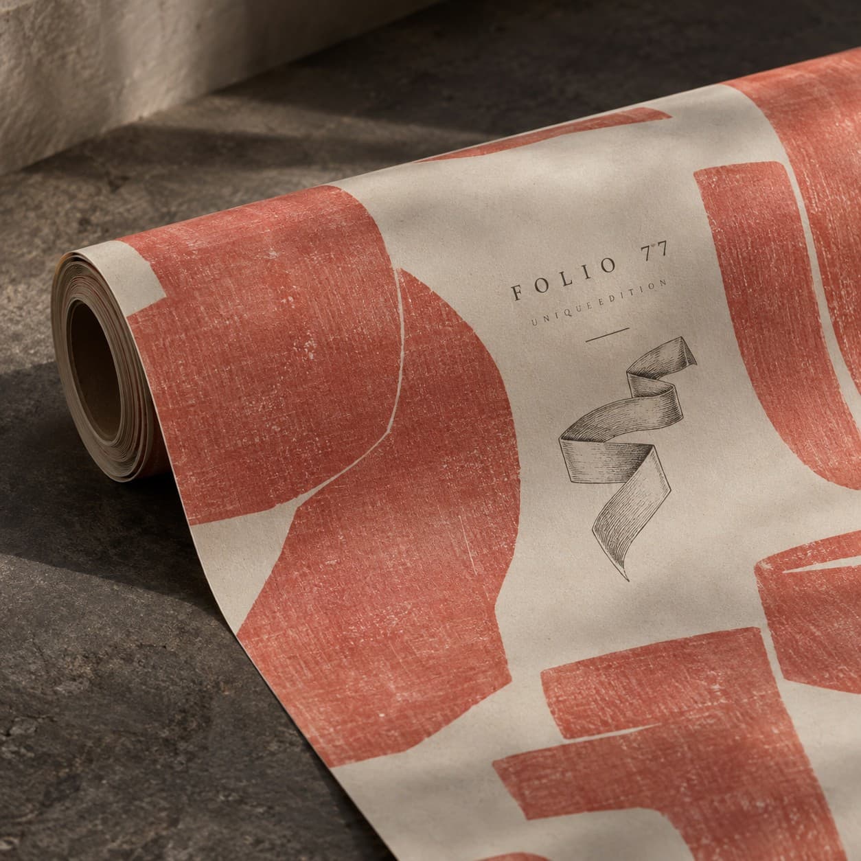 Gift Wrap Rolls — muted coral abstract block print, with a folded ribbon