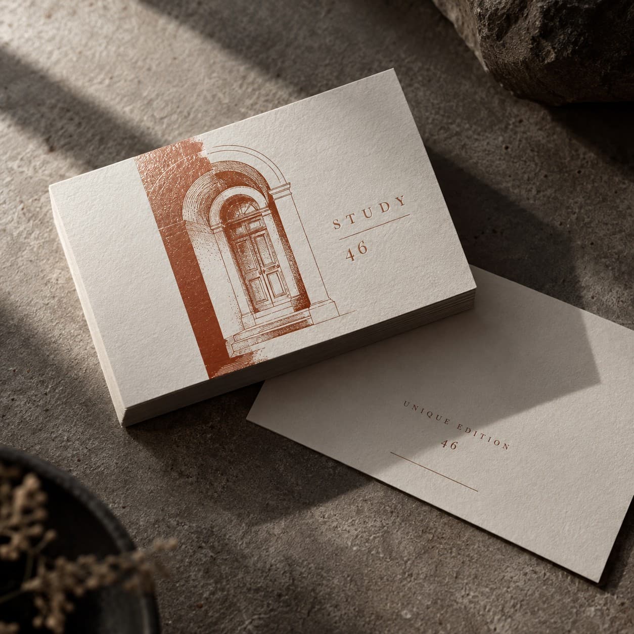 Spot UV Business Cards — a terracotta architectural arch drawing, with a doorway
