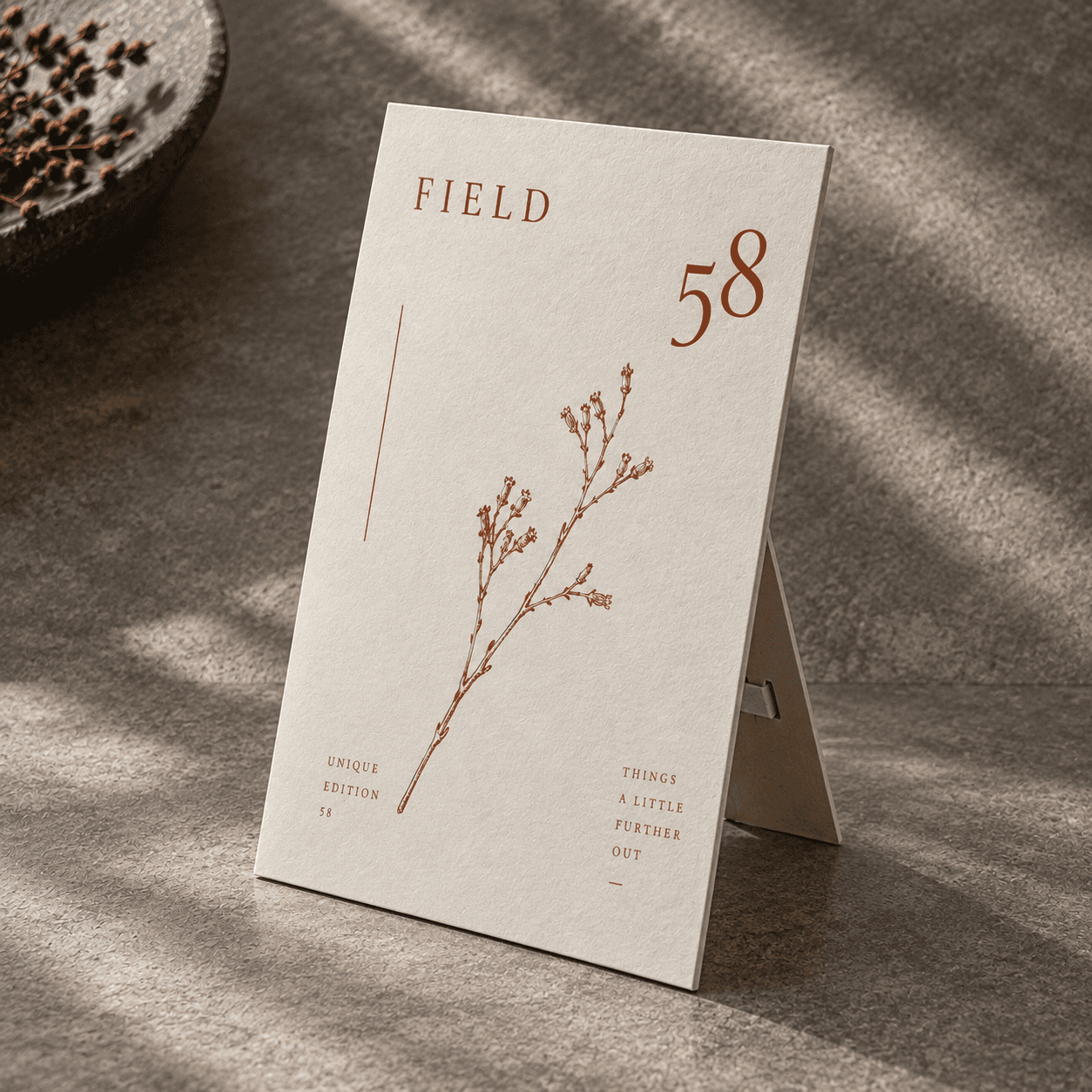 Strut Card — rust botanical FIELD 58 artwork on a rigid upright board with a visible rear easel support